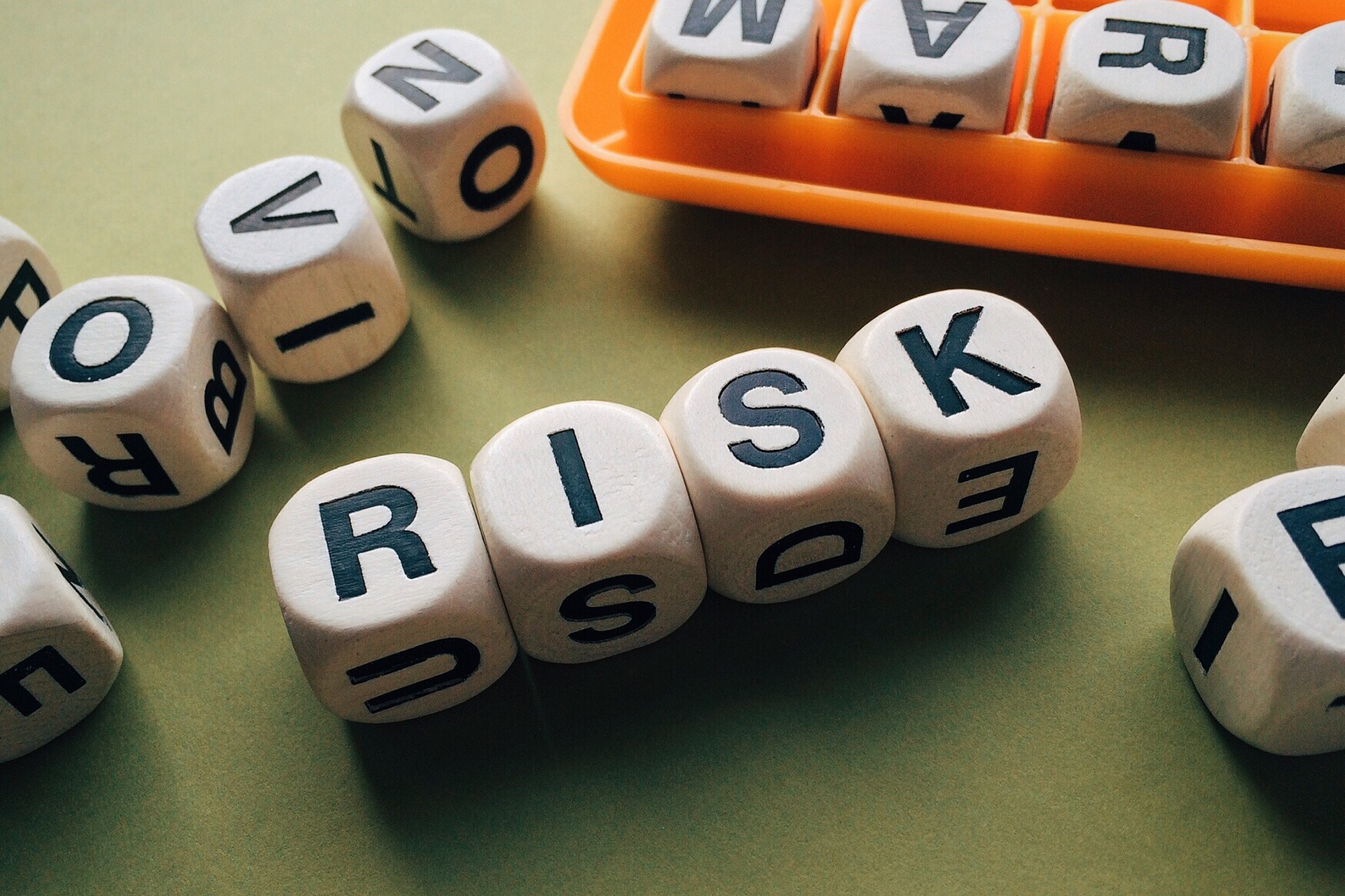 Scrabble tiles spelling the word risk, symbolising DNA Security's risk consultancy services